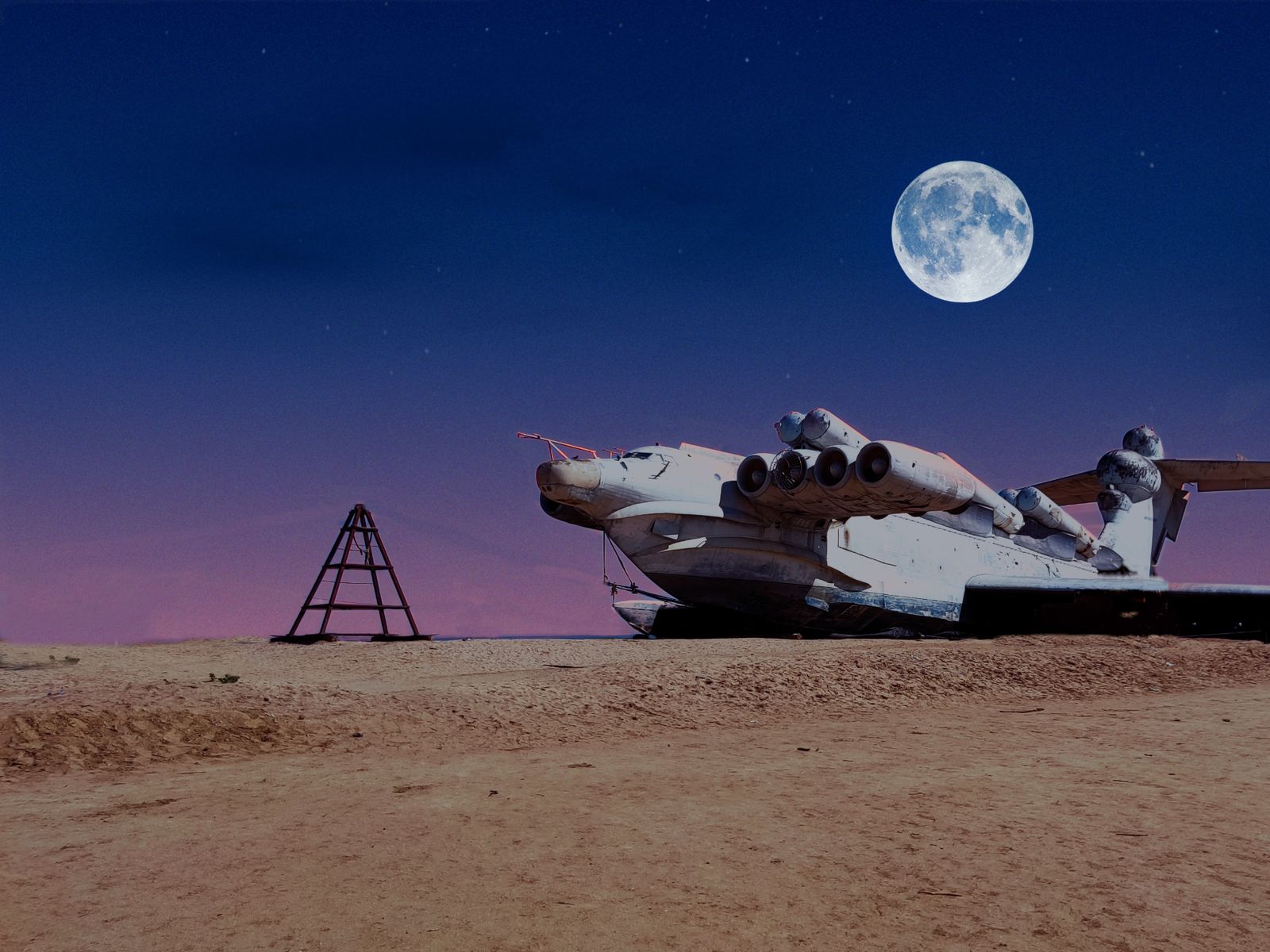 Экраноплан "Лунь" на фоне полной луны — словно корабль из будущего, затерянный в песках времени